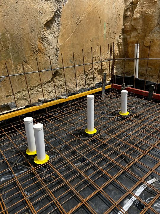Barrier installation through sandstone excavation
