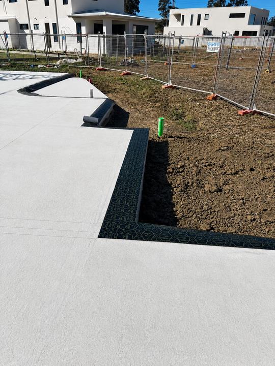 Barrier membrane visible along a finished slab edge